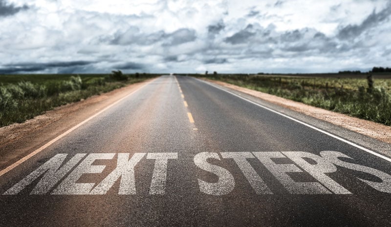 next-steps-written-on-rural-road