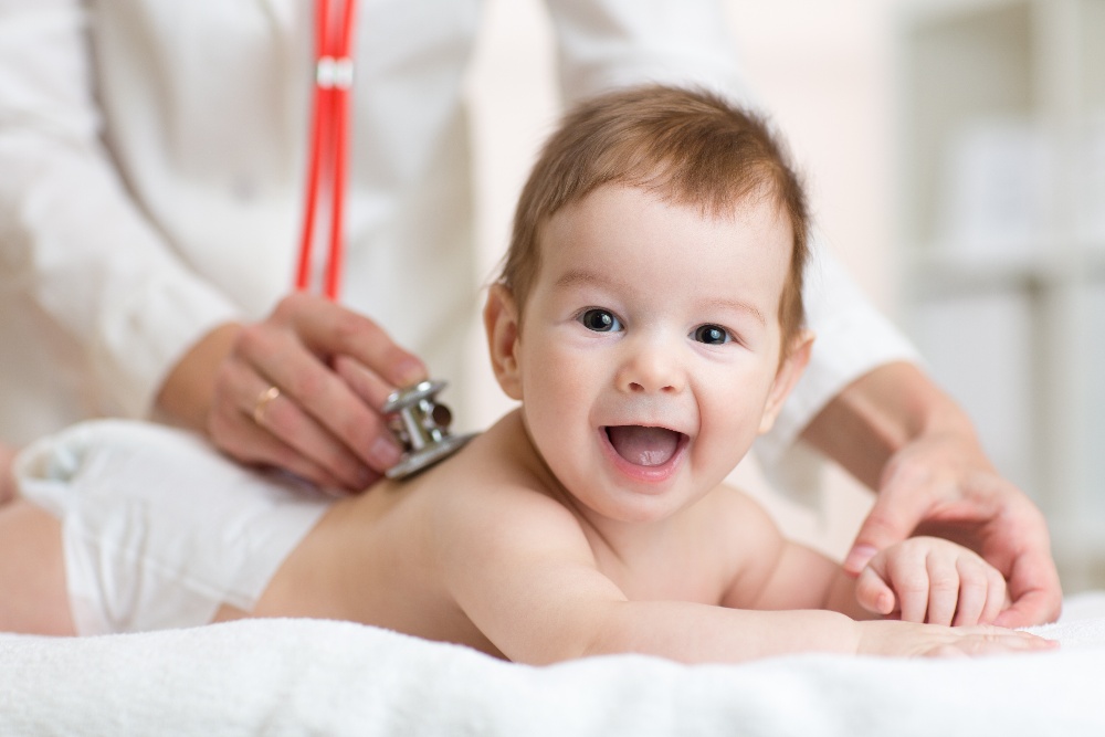 happy baby with doctor