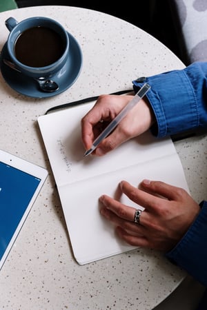 Woman writing in a calendar