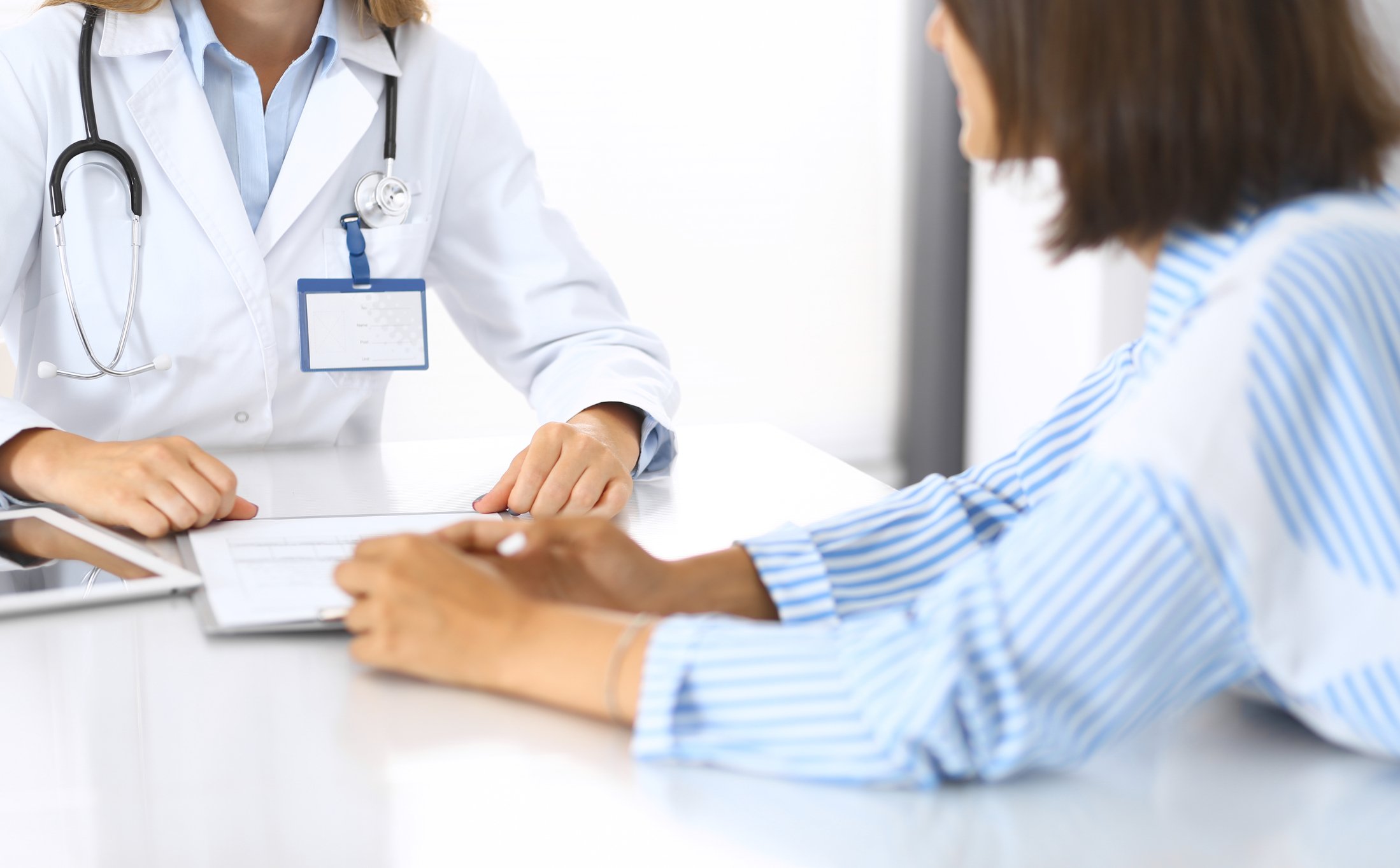 Doctor working with patient.