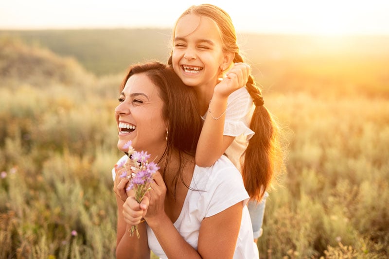 mother-and-daughter-playing-in-a-summertime-field